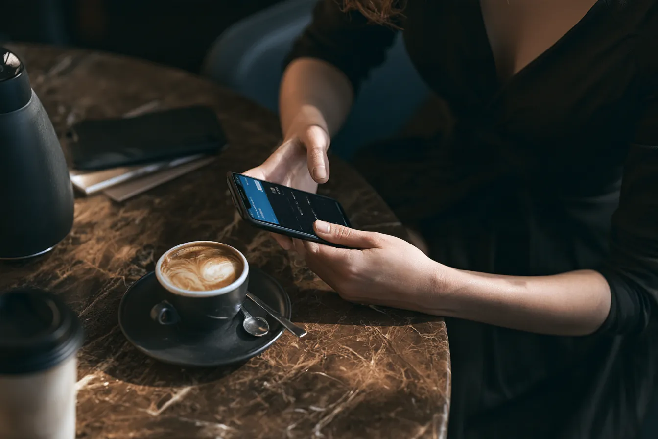 Borrower checking the credit score needed for a personal loan on a phone